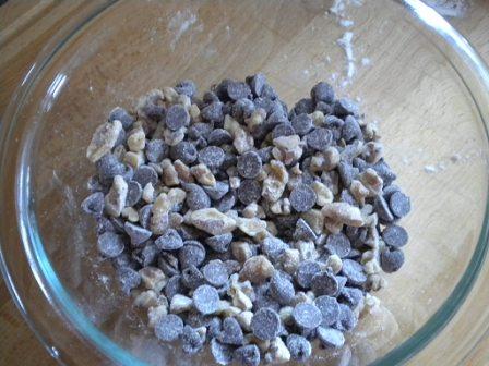 tip from granny: toss your chocolate chips/nuts in flour first before stirring them into a batter--it helps them stay suspended while baking